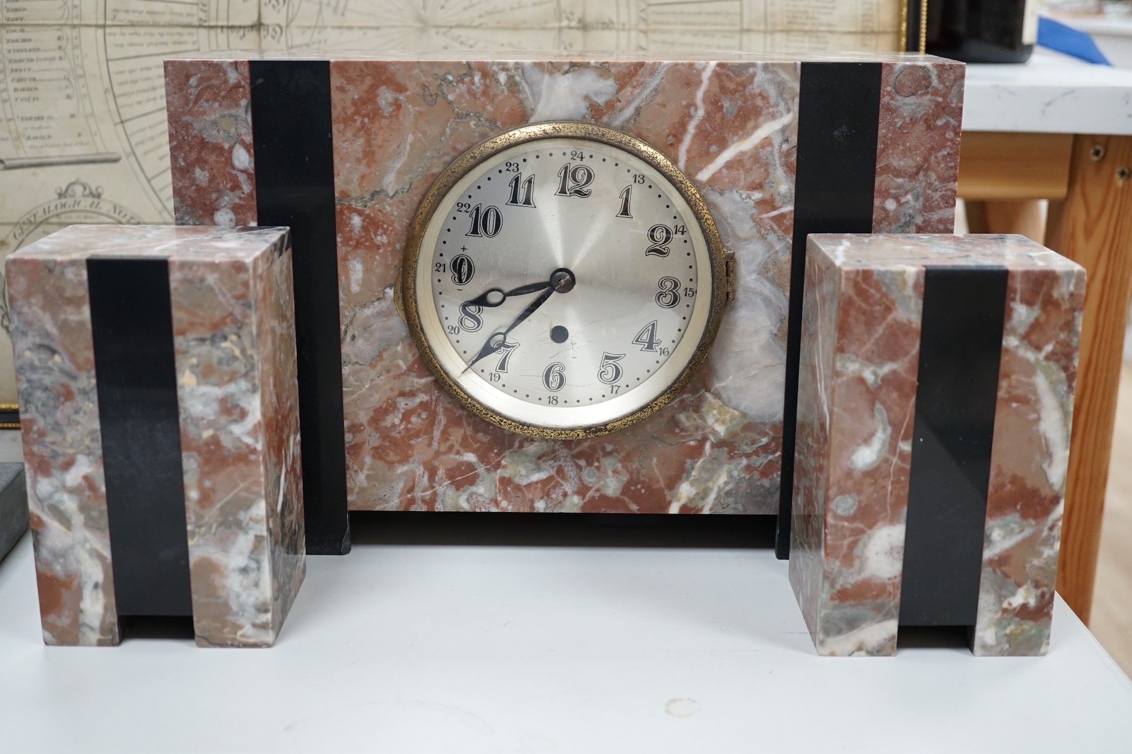 An Art Deco marble clock garniture